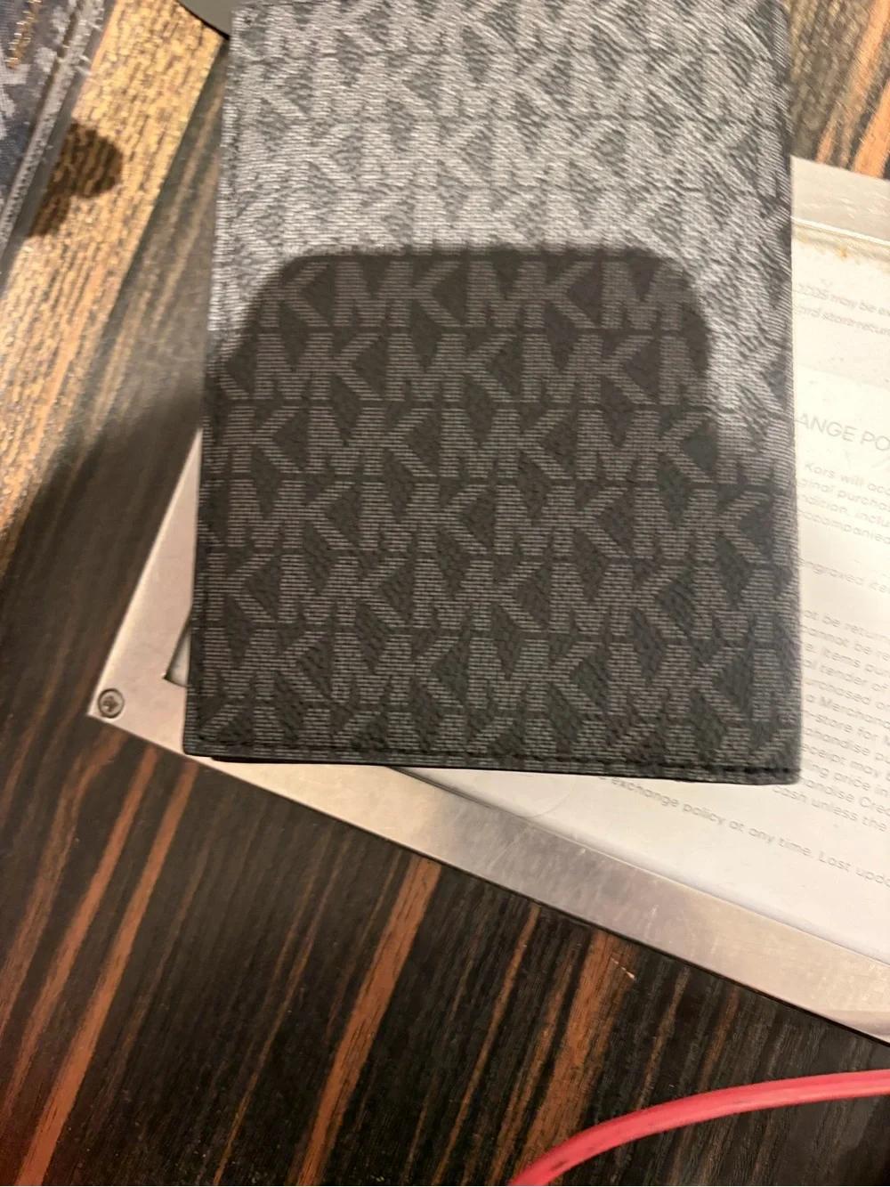 Michael Kors Black Signature MK Passport Wallet with Silver Logo